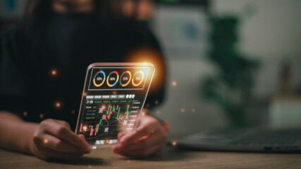 Businesswoman trader investor analyst using app analytics on the futuristic virtual interface screen. for cryptocurrency financial market analysis, trading data index chart graph on the smartphone.