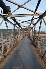 Old rusty metal bridge in Romania, Eastern Europe - 573356944