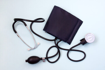 Sphygmomanometer. Mechanical tonometer for non-invasive measurement of blood pressure on blue...