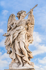 Rome, Italy: Statue of an Angel with the Lance by Domenico Guidi on Sant'Angelo Bridge in front of...