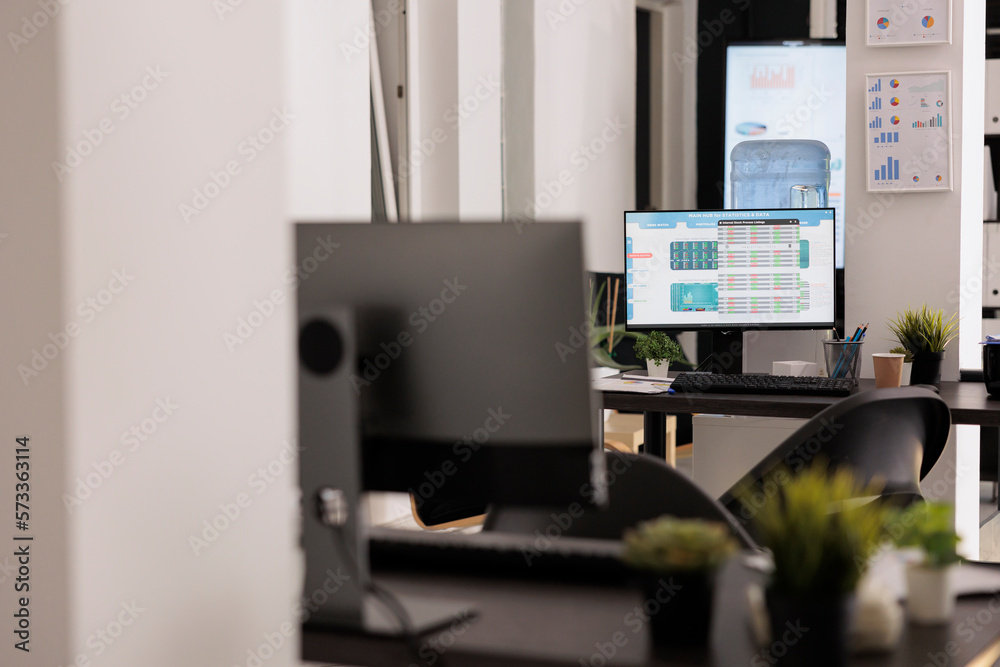 Poster workplaces with display computers on wooden table in a modern coworking space. office with electroni