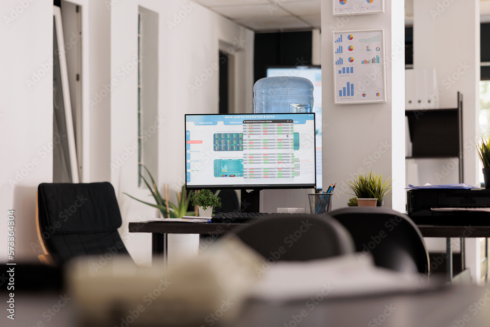 Poster computer screen on desktop showing main software for data analysis and financial results of the comp