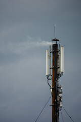 Obraz premium smoking chimney with telecommunications