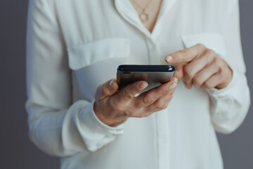 Trendy business owner woman hanging in social media using phone
