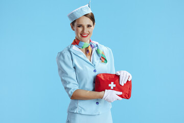smiling modern air hostess woman on blue