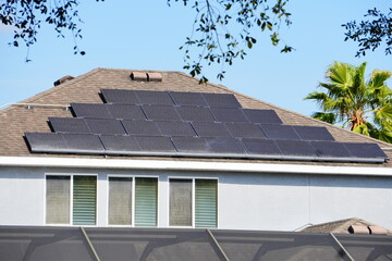 Solar panel on a house roof; Green energy from sun	