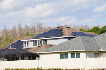 Obraz premium Solar panel on a house roof; Green energy from sun 