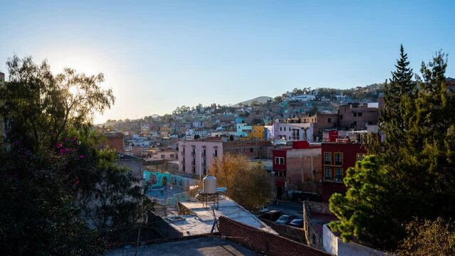 Beautiful timelapse footage of the city at sunset in the Mexican city of Guanajuato surrounded by large mountains.