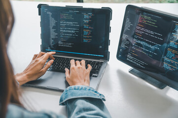 Female programmer working on coding, software development and web design.Concept technology...