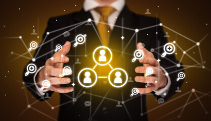 Hand holding social media icons