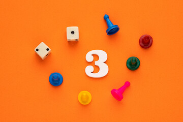 Number 3 with dice and board game pieces - Orange eva rubber background