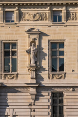 Architectural details of old buildings in Paris: The Criminal Court of Paris (Tribunal Correctionnel) located at the Palais de Justice at 14 Quai Goldsmiths. Paris. France.