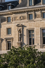 Fototapeta premium Architectural details of old buildings in Paris: The Criminal Court of Paris (Tribunal Correctionnel) located at the Palais de Justice at 14 Quai Goldsmiths. Paris. France.