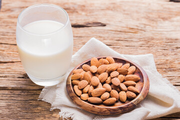 milk and almond seeds (Prunus dulcis) close-up image