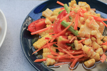 Thai spicy corn salad. Corn salad is adaptation menu from green papaya salad recipe (SOM TAM). Traditional Isan food in Thailand