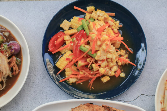 Thai spicy corn salad. Corn salad is adaptation menu from green papaya salad recipe (SOM TAM). Traditional Isan food in Thailand