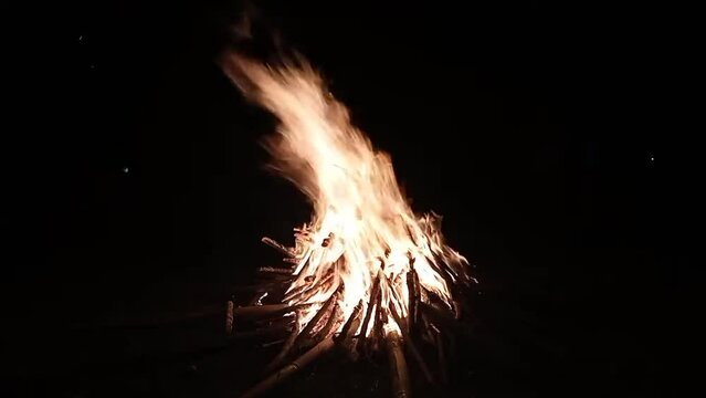 Camp fire in the night. Exploring the wildness travelling in outdoor