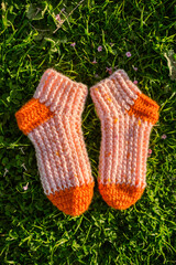 Socks against green grass and sky