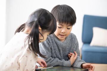Children playing games and studying on tablets