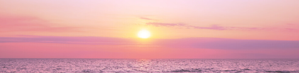 Naklejka na ściany i meble Beautiful panorama of sky over sea at sunset. Banner design