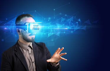 Businessman looking through Virtual Reality glasses, virtual security concept