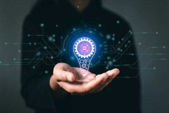 Hand with lightblub and coding AI futuristic future digital technology. Innovation, inspiration, creative solution idea for modern business intelligence technology concept.