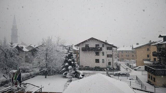 Heavy snow falling in little italian village Pinzolo trentino alto adige Italy