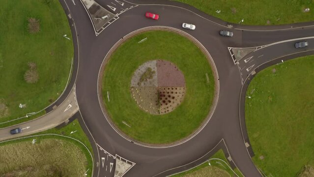 Top aerial spinning shot of an Irish roundabout. Gort, Galway, Ireland,