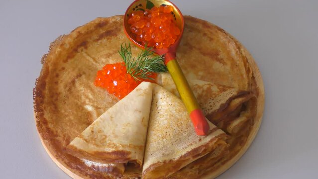 Pancakes with red caviar, cooked for Maslenitsa. Maslenitsa is an East Slavic traditional holiday celebrated during the week before Lent.