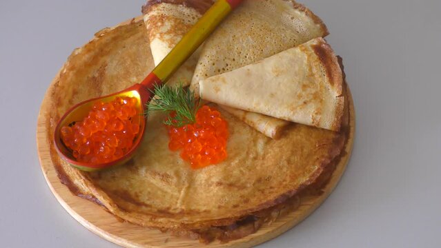 Pancakes with red caviar, cooked for Maslenitsa. Maslenitsa is an East Slavic traditional holiday celebrated during the week before Lent.