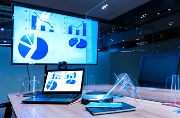 Mock up chart diagram presentation on display laptop and television in meeting room