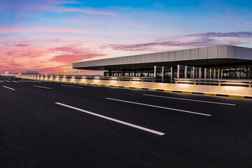 Asphalt road and colorful sky cloud background at sunrise