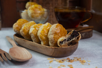 selective focus on crispy dry bakpia snacks usually served with hot tea suitable for eating when breaking the fast in the month of Ramadan. soft focus