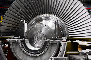New rotor of powerful steam turbine in plant workshop
