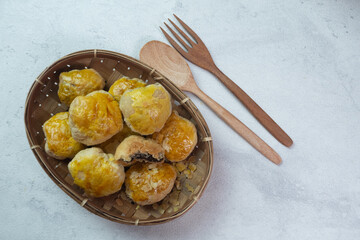 selective focus on crispy dry bakpia snacks usually served with hot tea suitable for eating when breaking the fast in the month of Ramadan. soft focus