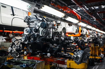 Automobile motor on assembling conveyor in workshop