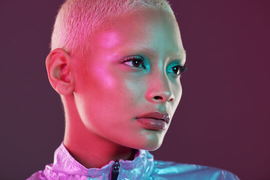 Vaporwave profile, black woman and cyberpunk cosmetics with model thinking in a studio. Isolated, glow makeup and futuristic cyber fashion of a young person with chrome clothing and scifi design