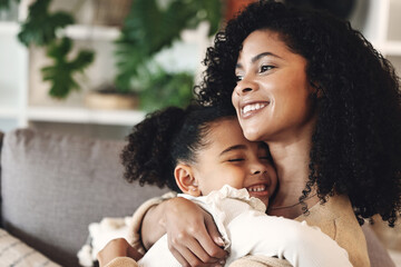 Black family, love and hug by girl and mother on a sofa, happy and relax in their home together....