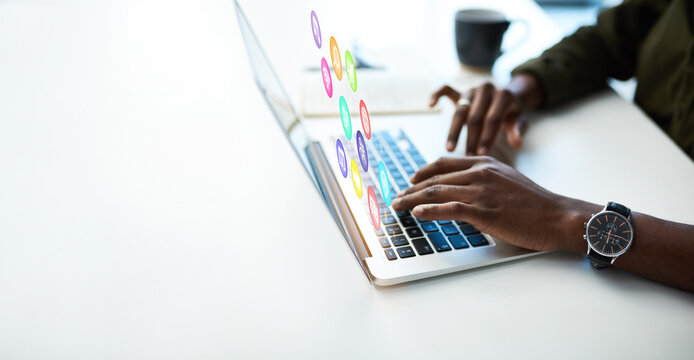 Man hands, laptop and icon hologram with notification dashboard for software application and internet. Creative person at office desk with mockup space for ai, ux and media with future erp innovation
