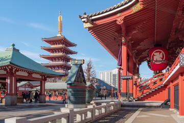 Famous tall pagoda and colorful red and green wood traditional Buddhist temple building complex at Senso-ji Buddhism temple in Asakusa Tokyo