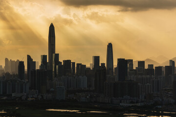 Fototapeta premium Silhouette of skyline of Shenzhen city, China under sunset. Viewed from Hong Kong border