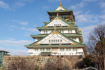 Green and white traditional Japanese architecture building of the Osaka Castle in Osaka Japan