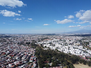 a drone photo of city aerial view in a hispanic place, in puebla, mexico, landscape of the city