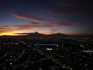 a drone aerial photo of the sunset in a hispanic city, puebla de zaragoza, mexico, travel, beautiful landscape 1