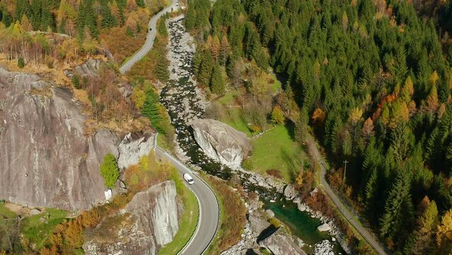 Aerial View Of Cars Driving On Mountain Pass In Val di Mello During Autumn In Lombardy, Italy.