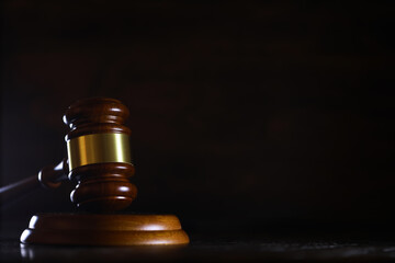 Judges gavel on wooden desk. Law firm concept.