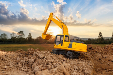 Crawler Excavators are bucket lift up in the construction site on the sunset  backgrounds.
