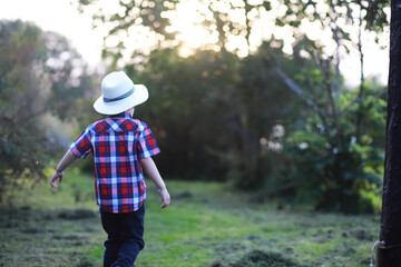 Children for a walk in the autumn park. Leaf fall in the park. Family. Fall. Happiness.