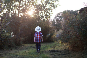 Leaf fall in the park. Children for a walk in the autumn park. Family. Fall. Happiness.