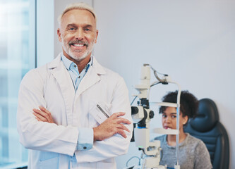 Portrait, man and smile of optometrist with arms crossed in hospital or medical clinic for eye care. Healthcare, vision or happy, confident or proud senior male ophthalmologist or doctor with patient